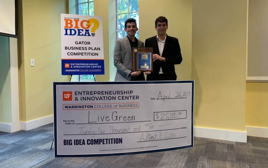 Pablo Garces and Brian De Souza with their first place $25,000 check at the Big Idea Competition.