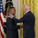 Image of Juan. Ε. Gilbert, PH.D., chair of the University of Florida Department of Computer & Information Science & Engineering, shaking hands with U.S. President Joe Biden.