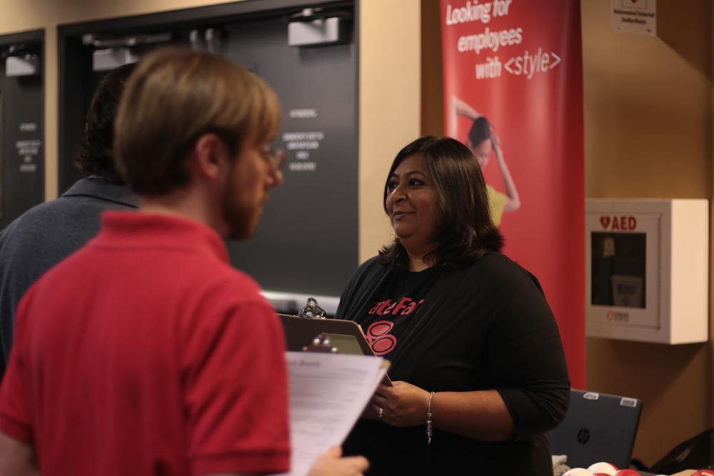 A representative from State Farm interviews a student