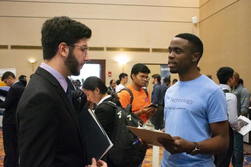 A student talks with a representative from American Express.