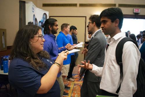 A student talks with a representative from Intel.